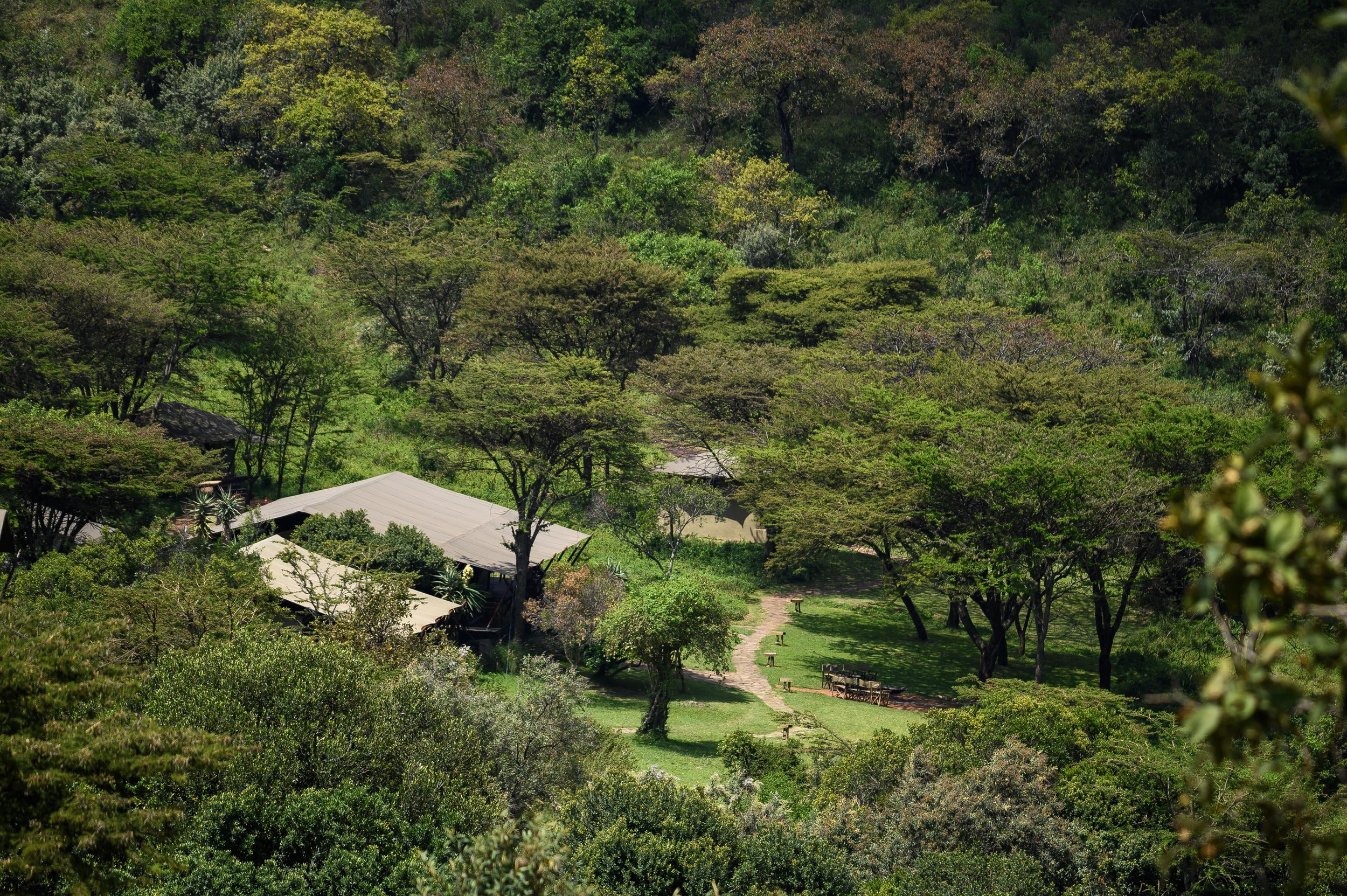 The green valley and mess area of Entumoto Safari Camp